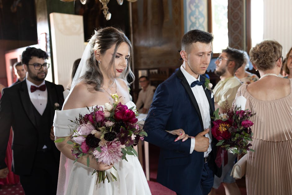 A bride and groom are captured during a wedding flower presentation at Forty Hall Enfield, part of the 'Wedding flowers Forty Hall Enfield before and after' event documented by floristenfield.co.uk. T